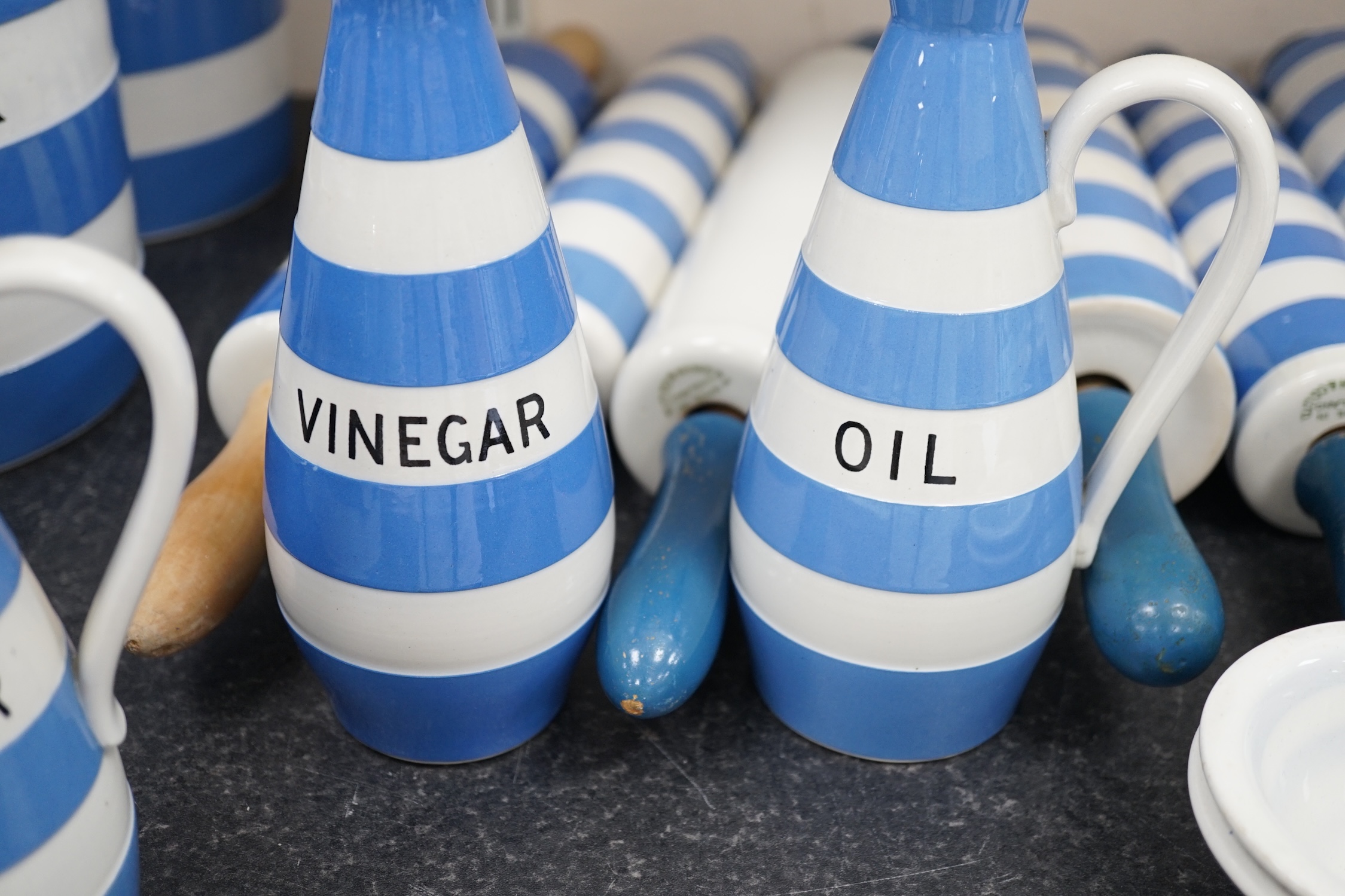 T.G.Green Cornish Kitchenware, six rolling pins one marked Cocogem but four unbranded, four Vinegar, Sauce and oil bottles, four small unnamed lidded storage jars and two egg separators mainly Green Shield marks. Conditi